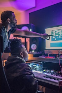 two men working in a recording studio